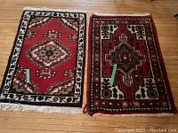Two mats side by side laid on wooden floor