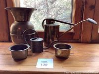 Overall view of all five items on wooden surface