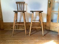 Front view of both pine stools on hardwood floor
