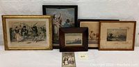 Group photo of multiple framed vintage prints and an old photo, showing variety of subjects including dancing couples, nautical theme, and animals.