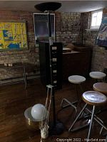 Overview of all items in lot: torchiere floor lamp, table lamp, glass globe and metal bowl