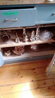 Shelf overview showing creamer, serving dishes, punch bowl, sugar bowl and bell.