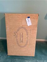 Cardboard preservation box labeled 'Legacy Boxes' for wedding dress storage