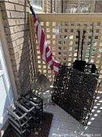 Close-up of the flagpole end and upper portion of the folded American flag.