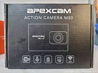 Front of Apexcam M80 box showing product name, image, and key features: 4K video, EIS, voice control, waterproof to 131 feet, WiFi.