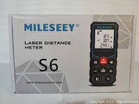 Box front showing Mileseey branding and image of laser distance meter S6 model.