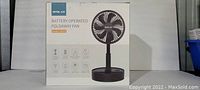 Front of the Opolar foldaway fan box showing brand, product type, and design image.