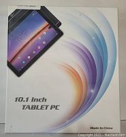 Photo of the product box showing the 10.1 inch tablet PC with graphic design, branding and text on the box.