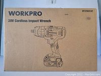 Photo of original box for Workpro 20V Cordless Impact Wrench with model number W125042AE and line art drawing of the tool on front.