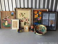 Photo showing entire collection from front angle with all framed floral artworks, ceramic bowl, ceramic floral ornament, and nesting dolls