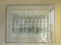 Front view of framed art print of King's College Chapel, showing the detailed Gothic architecture and water reflection with signature area visible at bottom right corner.