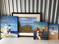 Four framed paintings displayed together, showing various scenes of women and landscapes near the coast