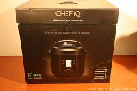 Box of Chef IQ multifunctional smart pressure cooker showing the front with product image and features.