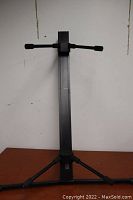 Front view of the Pyle Pro double keyboard stand showing the upright column and tripod base.