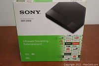 Box front with Sony BDP-S1500 Blu-ray/DVD player image and streaming services logos