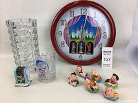 Photo showing 10 assorted decorative items: large clock, glass vase, etched glass, figurines, and small Mickey Mouse glass sharpener