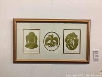 Full view of gold wood frame containing the three olive green prints mounted in a white double mat behind glass.