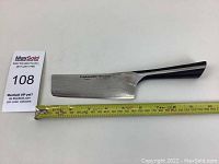 Full length profile of the 5" Nakiri knife with measuring tape showing approximately 11.5 inches total length.
