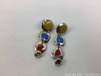 Two vintage sterling silver dangle earrings with colorful stones (yellow, blue, red) on plain white background.