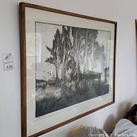 Framed print of cottonwood trees by Jack L. Orman showing overall condition and wood frame.
