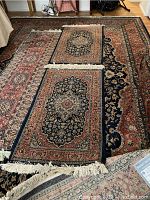 Overhead view of all four rugs overlapping to show pattern and colors