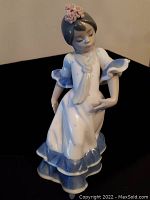 Front view of the Lladro porcelain figurine showing the flamenco dancer with detailed facial features and flower in hair.