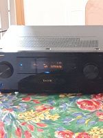 Front full view of the Pioneer ELITE receiver powered on showing the display and control knobs.