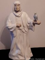 Front view of Royal Doulton Reflections Sheikh figurine with white bird on hand, in glossy white porcelain with intricate detail.