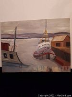 Full view of the folk art painting depicting a tugboat docked at the harbor with a shed and distant hills under an overcast sky.