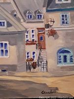 Close up of the house details in the painting, showing windows, doors, roof dormers, flower pots, street lamp with hanging flower basket, and an iron gate in front of one house.