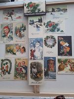 Full layout of 16 vintage Russian illustrated cards in winter themes with diverse colorful artwork.