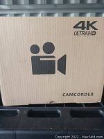 Front view of camcorder box showing 4K Ultra HD logo and camera icon