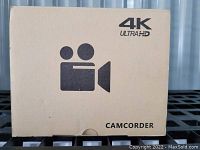 Front view of the cardboard box showing 4K Ultra HD branding and a camcorder icon