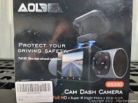 Front of the product box showing image of dash camera, branding, and key features like Full HD and infrared night vision.
