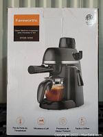 Front view of unopened white retail box featuring image and branding of Famiworths Steam Espresso Machine with Milk Frother model SYCM-5409.