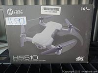 Front view of the Holy Stone HS510 drone box showing the drone image, brand, model HS510, 4K camera resolution, and age recommendation 14+.