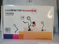 Front view of box showing LED desktop magnifier model with 160mm lens and various flexible arm configurations labeled A, B, and C.