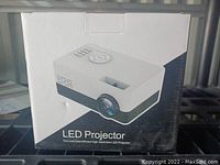 Front of projector box showing LED Projector image and labeling.