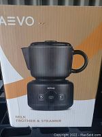 Photo of boxed AEVO Milk Frother & Steamer showing product image and brand on packaging.