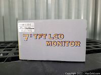 Box of Padarsey 7 inch TFT LCD Monitor with printed product name and power specifications label.