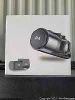Front of box shows the product name 'N4' and image of the dash cam and rear camera.