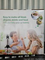 Box front shows a man and woman using the blender and highlights easy making of juice, drinks, and food to help babies grow healthily.