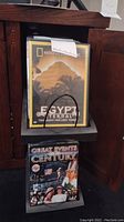 DVD titled 'Egypt Eternal - The Quest for Lost Tombs' and 'Great Events of the Century' displayed in media rack.