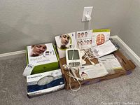 Overview of device, box, glove box, accessories on floor