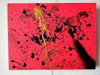 Front view of painting showing neon red background with black and gold splatters and artist signature