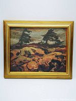 Front view of framed reproduction artwork showing landscape with stormy skies and trees.