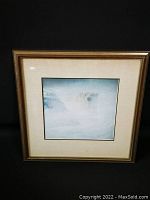 Overall view of the framed print showing the polar bear in a snowy scene and the gold-tone frame with light matting