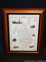 Framed vintage map print of Scotland shown full with wooden frame and black inner border.