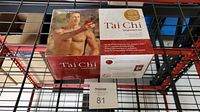 Front and top view of the boxed Gaiam T'ai Chi Beginners Kit on a metal shelf with label 81.