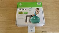 Photo of the Gaiam Total Body Balance Ball Kit packaging box showing front design and product details.